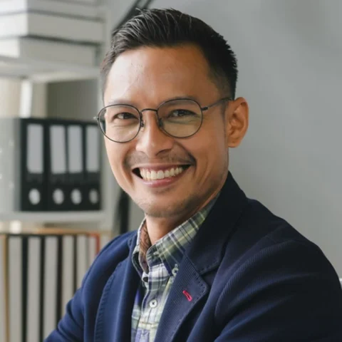 Businessman with glasses smiling